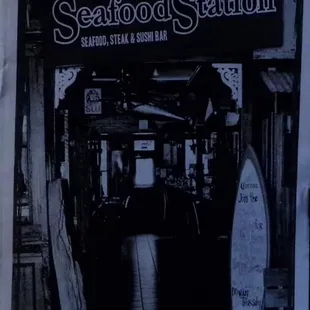a black and white photo of a seafood station