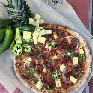 Holla Hawaiian is hot and sweet. Bacon, pineapple &amp; jalapeño pizza. A summer favorite!