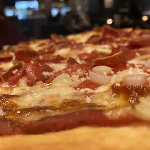 a pepperoni and onion pizza