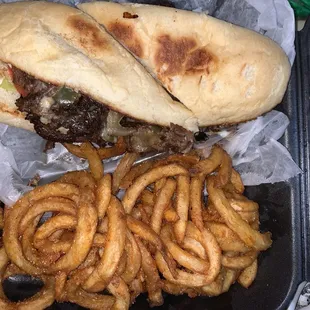 Philly cheesesteak with curly fries. Absolutely delicious!