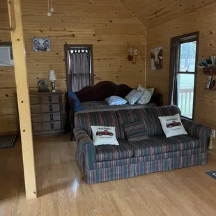 Bottom floor two of the 3 beds/ couch