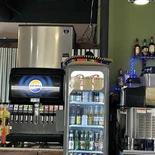 Self serve Pepsi fountain. You get your cups at the bar