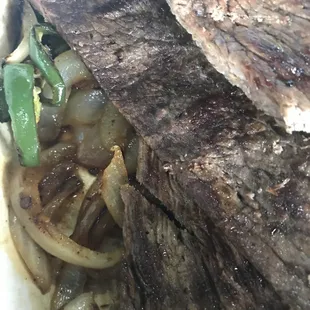 Carne asada w Grilled onions jalapeños and Gr peppers