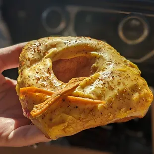 a person holding a donut