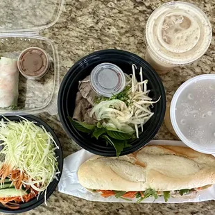 Shrimp rolls, beef pho, mango tea, veggie rice, and chicken banh mi