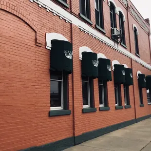a brick building with awnings
