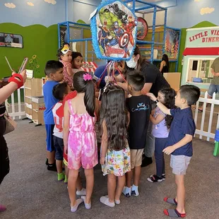 Pull string piñata indoors.