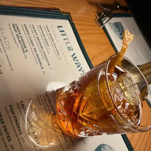 a drink being poured into a glass