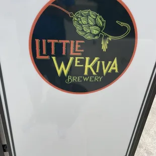 a sign for little wekiva brewery