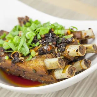 a plate of food with meat and vegetables