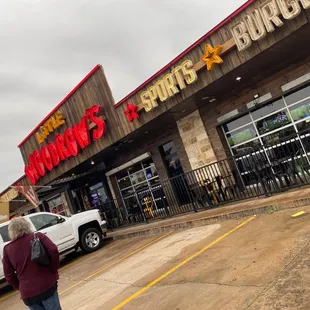 a woman walking in front of a store