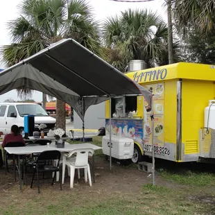 Little Yellow Latina food truck is tucked behind the gas station.
