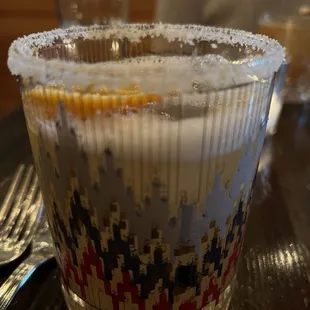 a shot of a drink in a plastic cup