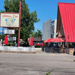a woman walking in front of the restaurant