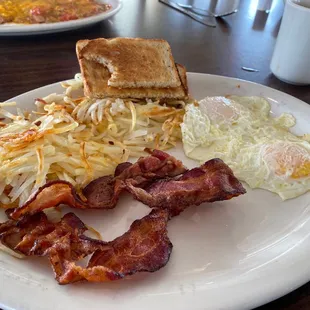 2 eggs over easy, hash browns , sourdough toast and bacon. Was perfect!
