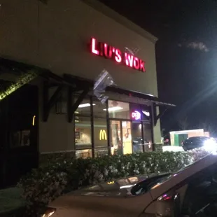 a car parked in front of a restaurant