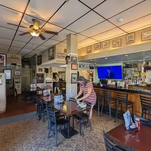 a woman sitting at a bar