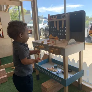 My nephew having fun in the tool area.