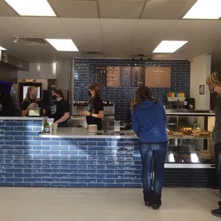 Pretty  blue tile at their counter for service.  Get your coffee, soda, or bakery.