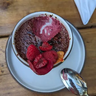 Hibiscus brulee with edible flowers and juicy berries (vegan)