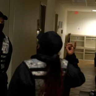 Interactive spy mission with live actors guarding the hallways, using laser guns to protect the area.