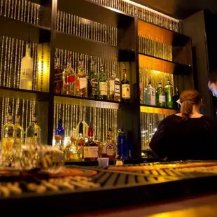 a man and a woman at a bar