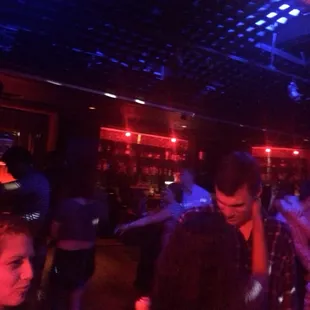 a group of people dancing at a party