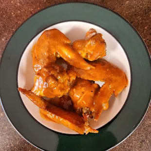 a plate of chicken wings