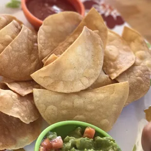 a plate of chips and guacamole