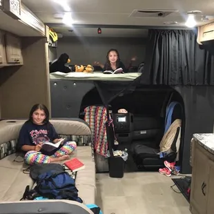 Two large sleeping areas besides the full master bed in back not pictured. The RV is huge with so much room with the slide out.