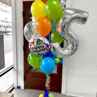 Dino Bouquet includes confetti balloons and a Jumbo number balloon!