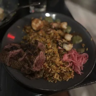 Paella* with skirt steak.
