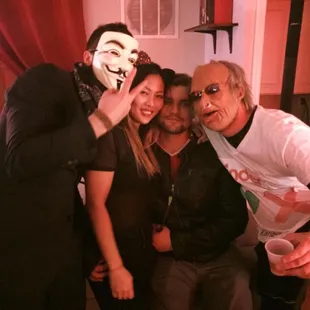 a group of people dressed in masks