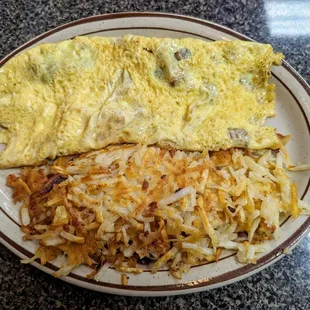 Gyro omlette with crispy hash browns (I prefer hash browns to country potatoes).