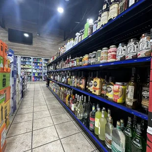 a wide aisle of liquor