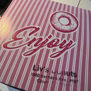 a close up of a box of doughnuts