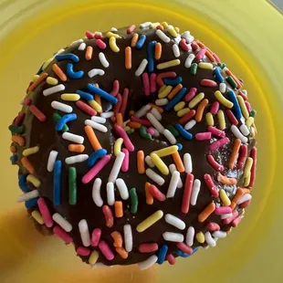 a chocolate donut with sprinkles