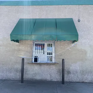 a window with a green awning