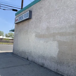 a street sign on the side of a building