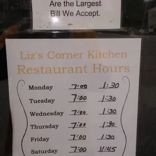  sign in the window of a restaurant