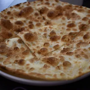 a flatbread pizza on a plate