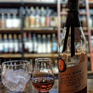 a bottle and two glasses