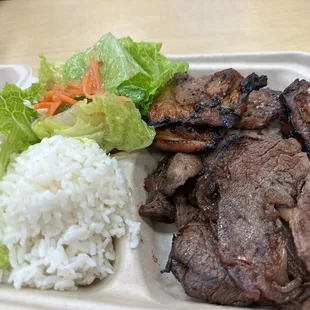 a plate of meat and rice