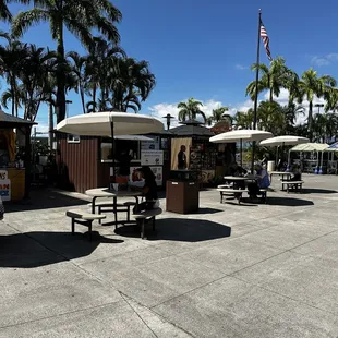 several tables and umbrellas