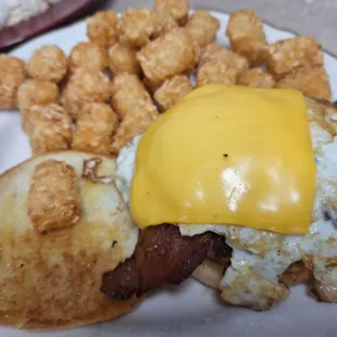 Breakfast burger with an egg and bacon. SO GOOD. One tater tot sat up on my bun. He was eaten first.