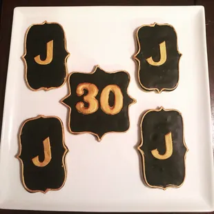 Black and gold custom cookies.