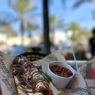 a hot dog with onions, onions, and ketchup