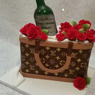 louis vuitton bag with roses and a bottle of wine