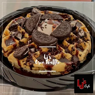 A warm, golden waffle infused with baked-in Oreo cookie pieces and rich chocolate chips, topped with fluffy marshmallow cream, a generous dr