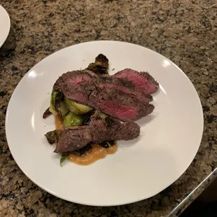 Grilled beef tenderloin, grilled Georgia peach purée sauce, sherry braised brussels.